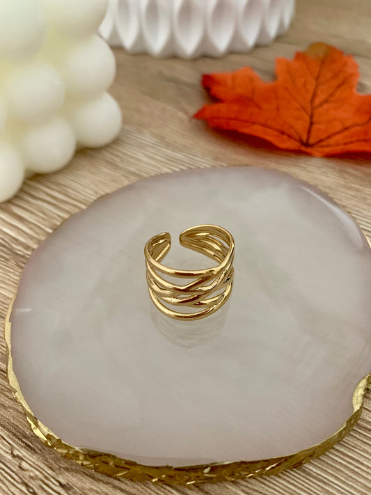 Bague Maya ligne tressé, acier inoxydable doré .