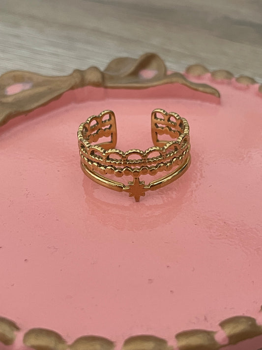 Bague étoile, Cyrius acier inoxydable doré.