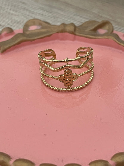 Bague, trèfle Kénya, en acier inoxydable doré.