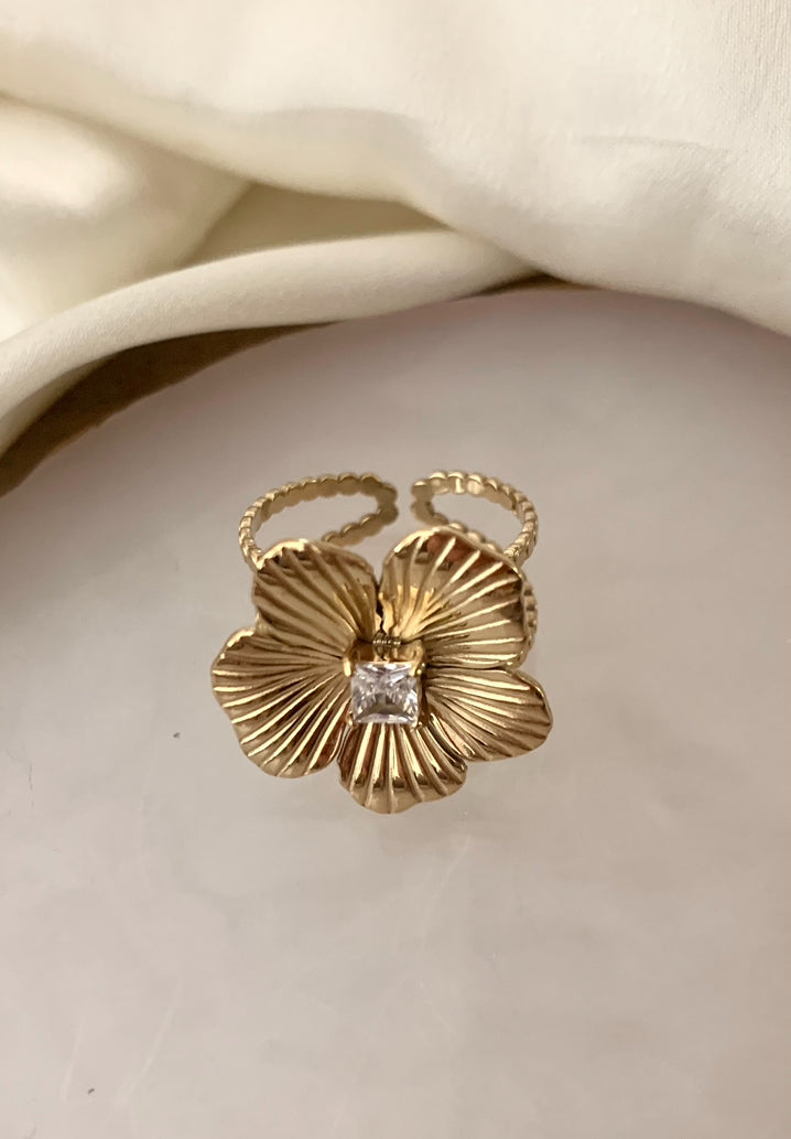 Bague Aloha fleur avec un strass , acier inoxydable doré .